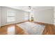 This main bedroom has wood floors, neutral paint, a ceiling fan and a bathroom ensuite at 11270 Stroup Road, Roswell, GA 30075