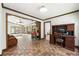 Open office with brick accent wall, built in desk and tile floors is a great work space at 11270 Stroup Road, Roswell, GA 30075