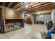 Unfinished basement with exposed ceiling, wood storage, and concrete flooring at 11270 Stroup Road, Roswell, GA 30075