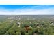 Neighborhood with large trees and a house with a pinpoint on it from an aerial view at 1637 Willow Way, Woodstock, GA 30188