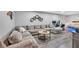 Spacious basement area with a large couch, wooden floors, and a recreation area at 1637 Willow Way, Woodstock, GA 30188