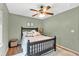 Comfortable bedroom with wood floors, ceiling fan, and neutral decor at 1637 Willow Way, Woodstock, GA 30188