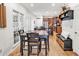 Dining area adjacent to kitchen with a wooden table, wooden floors, and plenty of natural light at 1637 Willow Way, Woodstock, GA 30188