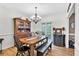 Traditional dining room with wooden table, chairs, and a decorative chandelier at 1637 Willow Way, Woodstock, GA 30188
