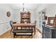 Bright dining room with wood floors, chandelier, and ample natural light at 1637 Willow Way, Woodstock, GA 30188
