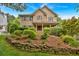 Charming two-story home with landscaped front yard and inviting curb appeal at 1637 Willow Way, Woodstock, GA 30188