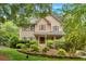 Inviting two-story home with a classic design and well-maintained yard at 1637 Willow Way, Woodstock, GA 30188