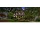 Beautiful home with manicured lawn and mature landscaping at 1637 Willow Way, Woodstock, GA 30188
