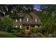 Charming two-story home with a covered front porch and lush landscaping at 1637 Willow Way, Woodstock, GA 30188