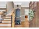 Inviting foyer with hardwood floors, staircase, and elegant decor at 1637 Willow Way, Woodstock, GA 30188