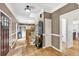 Welcoming foyer with hardwood floors, staircase, and a view into the kitchen at 1637 Willow Way, Woodstock, GA 30188