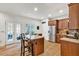 Bright kitchen with a center island, granite countertops, stainless appliances, and wood floors at 1637 Willow Way, Woodstock, GA 30188