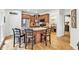 Beautiful kitchen with granite countertops, stainless steel appliances, wooden cabinets, and island seating at 1637 Willow Way, Woodstock, GA 30188