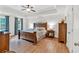 Spacious main bedroom featuring trey ceilings, hardwood floors and large windows at 1637 Willow Way, Woodstock, GA 30188