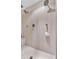 Modern walk-in shower with multiple showerheads and a built-in seat, designed for relaxation at 1637 Willow Way, Woodstock, GA 30188