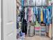 Walk-in closet with shelving, clothing, and storage containers providing lots of organization at 1637 Willow Way, Woodstock, GA 30188