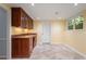 A basement area with built-in cabinets, counter, and a window for natural light at 2390 Sassafrass Ln, Powder Springs, GA 30127