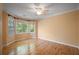 Cozy bedroom with bay windows providing natural light and hardwood floors at 2390 Sassafrass Ln, Powder Springs, GA 30127