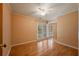 Bright bedroom with hardwood floors, ceiling fan, and sliding glass doors leading to a balcony at 2390 Sassafrass Ln, Powder Springs, GA 30127