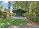 Backyard utility outbuilding, providing ample storage space or potential for use as workshop at 2390 Sassafrass Ln, Powder Springs, GA 30127