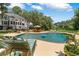Luxurious backyard oasis featuring a large in-ground pool, spacious deck, and plenty of seating at 2390 Sassafrass Ln, Powder Springs, GA 30127
