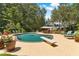 Stunning backyard retreat with a pristine pool, diving board, and a serene setting surrounded by mature trees at 2390 Sassafrass Ln, Powder Springs, GA 30127