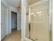 Bathroom featuring a tiled floor, glass shower, and access to a separate water closet at 3255 Clear View Dr, Snellville, GA 30078