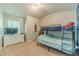 This bedroom features a fun bunk bed set and a dresser under the TV, perfect for ! at 3255 Clear View Dr, Snellville, GA 30078