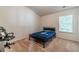 Comfortable bedroom with neutral carpet, a modern gaming chair, and a window with natural lighting at 3255 Clear View Dr, Snellville, GA 30078