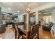 Open dining area with hardwood floors, modern light fixture, and seamless transition to living and kitchen spaces at 3255 Clear View Dr, Snellville, GA 30078