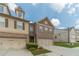 Charming townhouse showcasing brick and siding exterior, attached garages, and well-maintained landscaping at 3255 Clear View Dr, Snellville, GA 30078