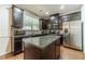 Modern kitchen featuring granite countertops, stainless steel appliances, and dark wood cabinetry at 3255 Clear View Dr, Snellville, GA 30078
