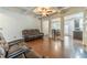 Bright living room with hardwood floors, coffered ceilings, an open layout with dining area, and neutral paint at 3255 Clear View Dr, Snellville, GA 30078