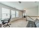 An open loft area features a large window for natural light, a comfortable desk area, and carpeted floors at 3255 Clear View Dr, Snellville, GA 30078