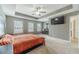 Spacious primary bedroom features a trey ceiling, neutral color palette, and a large window at 3255 Clear View Dr, Snellville, GA 30078