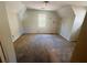 A third bedroom with carpet, neutral walls and a large window to let in light at 43 Oak Landing Cir, Douglasville, GA 30134