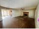 Spacious living room featuring a stone fireplace, ceiling fan and access to adjacent dining area at 43 Oak Landing Cir, Douglasville, GA 30134