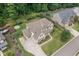 Stunning home featuring a manicured lawn, mature trees, and a long driveway at 4460 Hunters Walk Way, Cumming, GA 30028