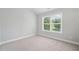 Bright bedroom with large window at 4460 Hunters Walk Way, Cumming, GA 30028