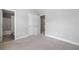 Neutral bedroom with ensuite bathroom, grey carpet, and vaulted ceiling at 4460 Hunters Walk Way, Cumming, GA 30028