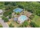 Aerial view of the community pool, tennis courts, playground, and clubhouse at 4460 Hunters Walk Way, Cumming, GA 30028
