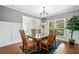 Elegant dining room with a large window and a stylish chandelier at 4460 Hunters Walk Way, Cumming, GA 30028
