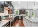 Kitchen with stainless steel appliances, granite countertops, subway tile, and pendant lights at 4460 Hunters Walk Way, Cumming, GA 30028