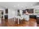 A kitchen with stainless steel appliances, an island and wooden flooring at 4460 Hunters Walk Way, Cumming, GA 30028