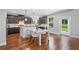 Spacious kitchen with stainless appliances, center island and views of the backyard at 4460 Hunters Walk Way, Cumming, GA 30028