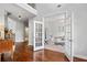 Bright office featuring French doors, hardwood floors, and ample natural light at 4460 Hunters Walk Way, Cumming, GA 30028