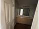Bathroom boasts a double sink vanity with wood cabinets and modern lighting fixture at 138 Shady View Pl, Lawrenceville, GA 30044