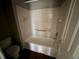Bathroom features a white tub and shower combo, toilet and wall shelves at 138 Shady View Pl, Lawrenceville, GA 30044