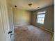 Bedroom with neutral walls, window providing natural light and plywood subfloor at 138 Shady View Pl, Lawrenceville, GA 30044