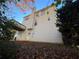 Back exterior view of a two story home, features a chimney and wooden deck at 138 Shady View Pl, Lawrenceville, GA 30044